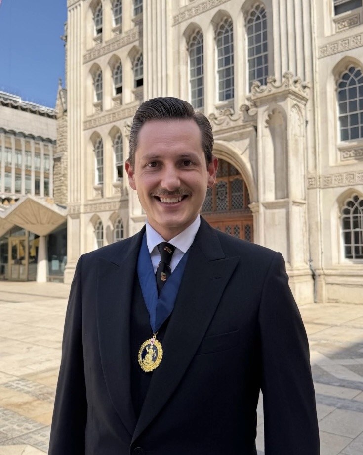 Liam Randall outside Guildhall in the City of London, wearing his Ale-Conner badge